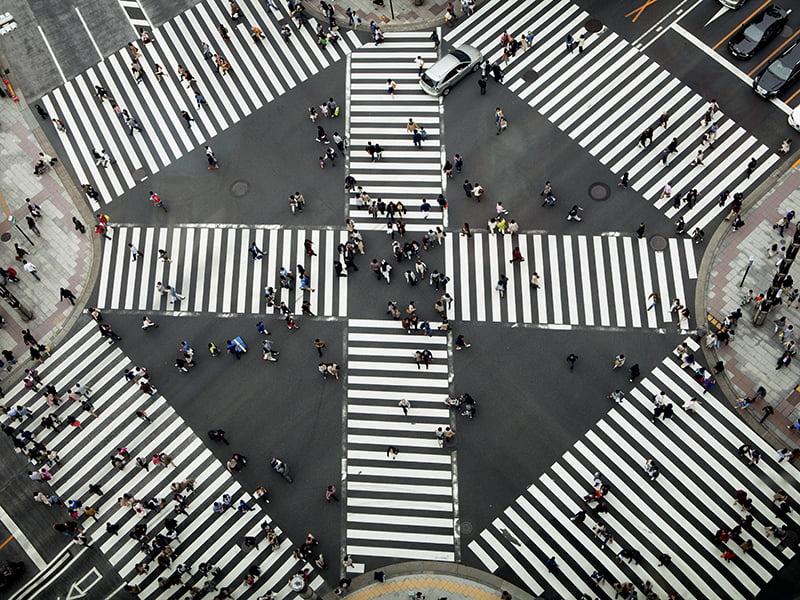 people crossing city connections